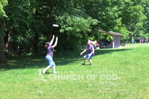 Two World Mission Society Church of God members playing Frisbee during Taylorsville Lake Family Cookout
