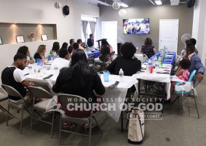 Guests watching World Mission Society Church of God introduction video during a Father's Day Appreciation Dinner in Louisville, KY