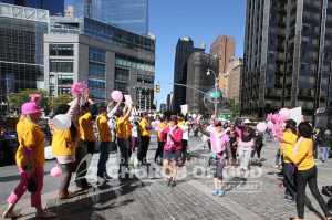 World Mission Society Church of God volunteers cheering walkers during Avon Walk for Breast Cancer 2013