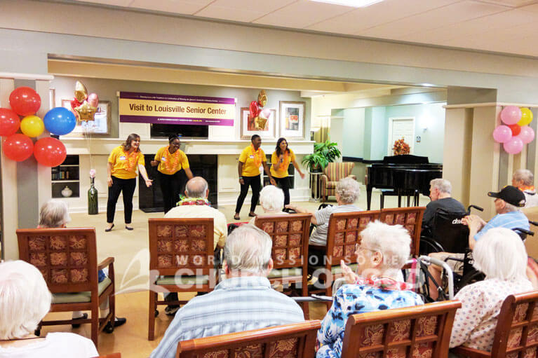 World Mission Society Church of God volunteers performing for the residents of Atria Senior Living