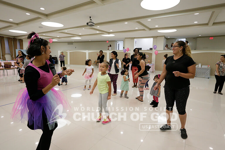 World Mission Society Church of God member leading Mommy and Me Dance Class