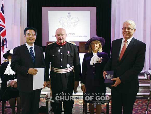 image of the World Mission Society Church of God and Queens Award representatives