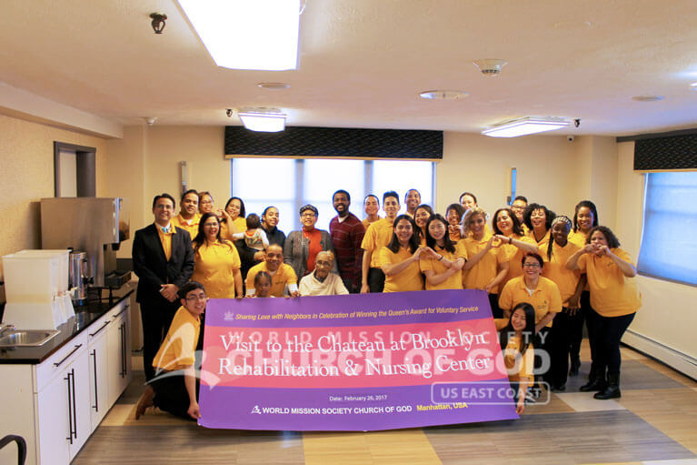 Group photo of World Mission Society Church of God volunteers and nursing home staff after Chateau Nursing Center visit