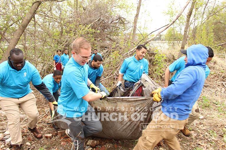 ASEZ volunteers removing trash from an area in Manchester, NH