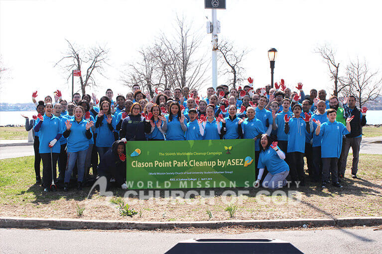 Group photo of ASEZ volunteers from Lehman College and affiliates during their cleanup at Clason Point Park.