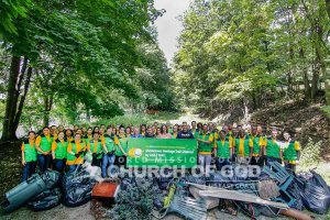 Group photo of ASEZ WAO volunteers during the Orange County Heritage Trail Cleanup in Middletown with Senator Jennifer Metzger.