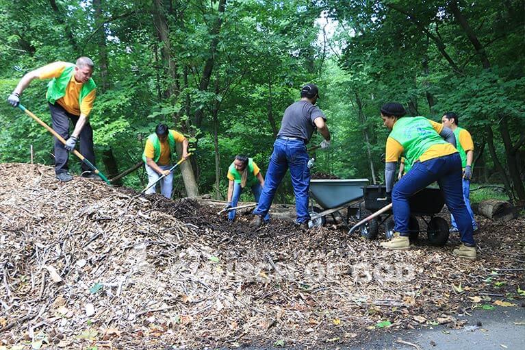 ASEZ WAO members putting down mulch at the Thomas Edison Center