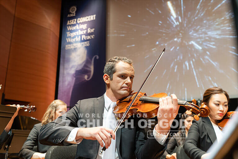Church of God violinists playing at the Lincoln Center Alice Tully Hall