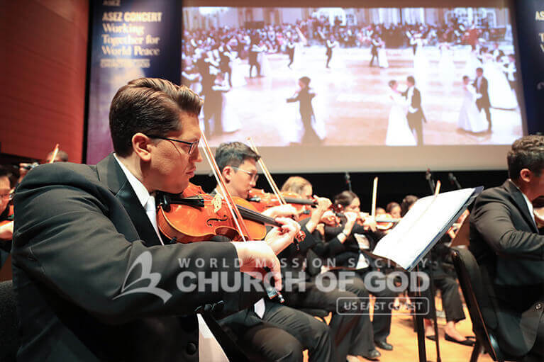 Violinists playing during the ASEZ concert at the Lincoln Center