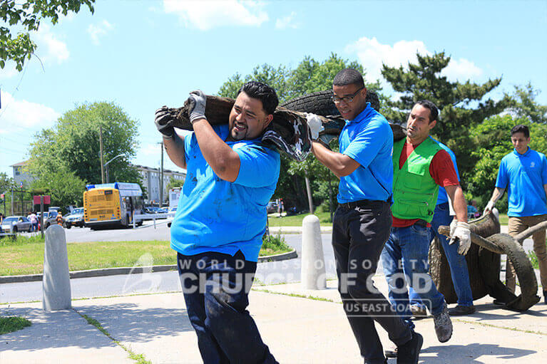 ASEZ students cleaning up debris from around Clason Point Park.