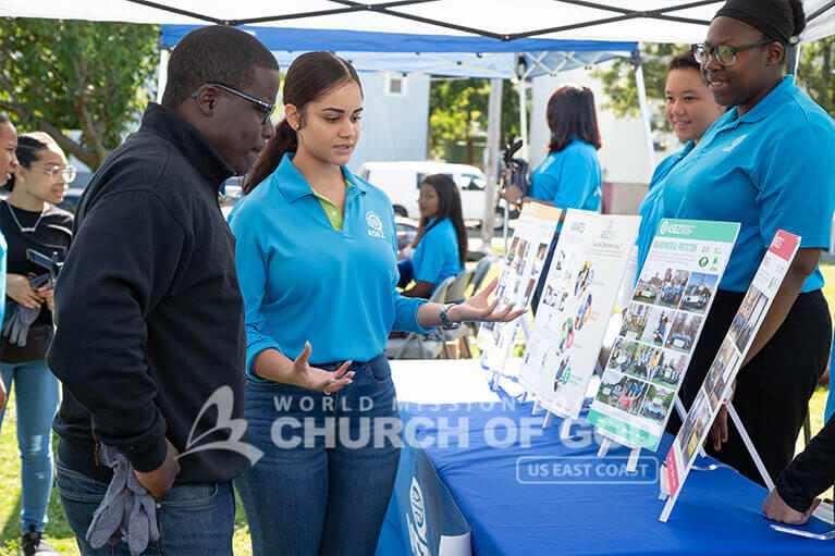 Councilman Owusu Aneke learning more about ASEZ's volunteer activities.