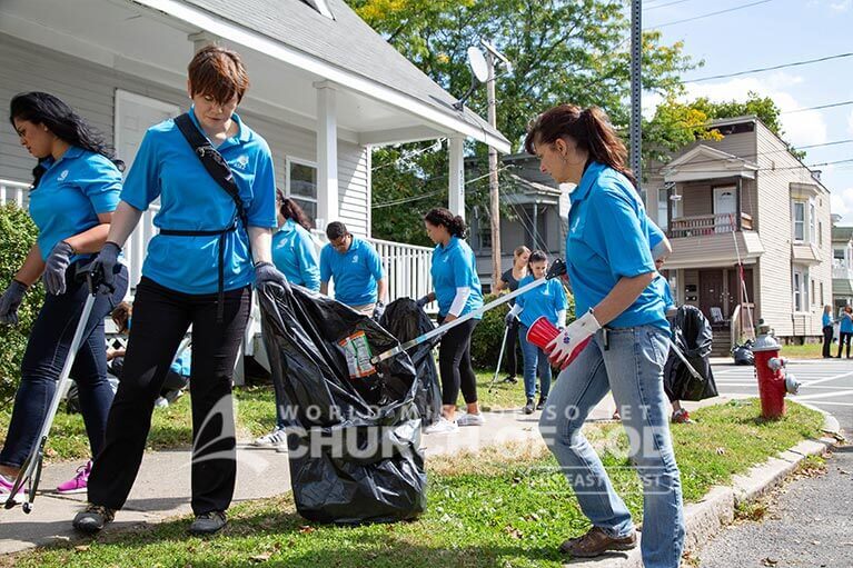 Judge Regina Rinaldi cleaning up trash in Albany with ASEZ.