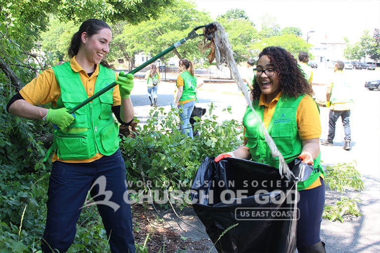 WMSCOG members joyfully picking up trash from Howard Street in Nashua.