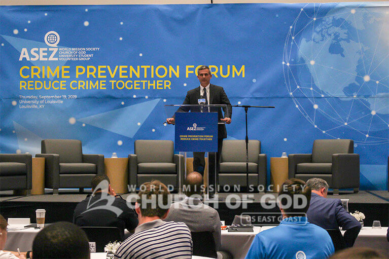 Professor Luke Milligan speaking to students during the Crime Prevention Forum at the University of Louisville