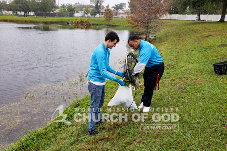 Volunteers from ASEZ cleaning Leroy Hoequist Park.